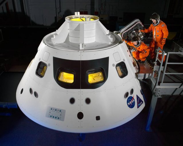 Astronauts go into an Orion capsule mock-up. The un-manned spacecraft is expected to be ready for launch in 2020.