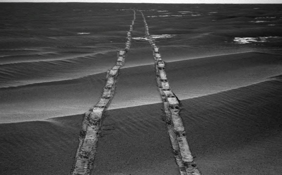 In this navigation camera raw image, NASA's Opportunity Rover looks back over its own tracks on Aug. 4, 2010.