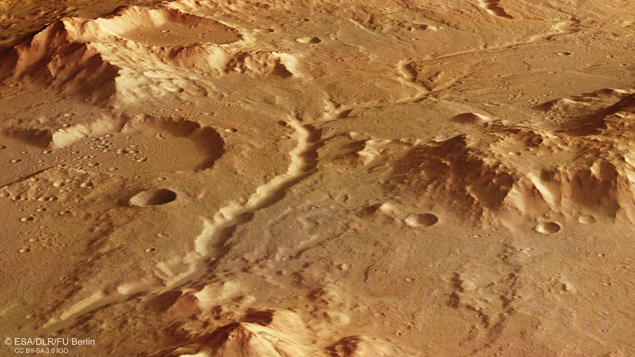 A perspective view of an ancient river channel in the Libya Montes region of Mars, created by the DLR high-resolution stereo camera on board Mars Express.