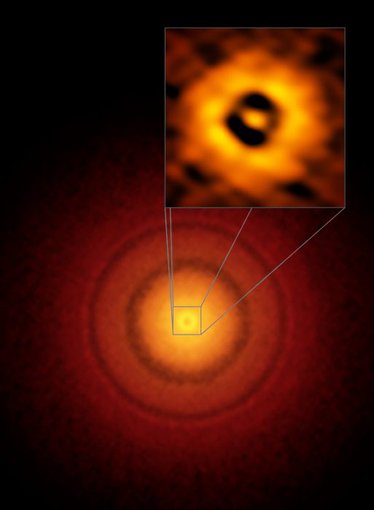 ALMA images of details in the planet-forming disk around a nearby sun-like star, TW Hydrae, including a gap at the same distance from the star as the Earth is from the Sun, suggesting a planet might be forming.