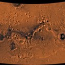 Color image of part of the Ismenius Lacus region of Mars (MC-5 quadrangle) containing the impact crater Moreux (right center); north toward top.
