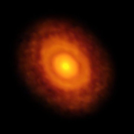 This planet-forming disc around the young star V883 Orionis was obtained by the European Southern Observatory’s  Atacama Large Millimeter/submillimeter Array (ALMA), a prime site for radio astronomy. The star is a state of “outburst,” which has pushed the water snow line further from the star and allowed it to be detected for the first time. The dark ring midway through the disc is the water snowline, the point from the star where the temperature and pressure dip low enough for water ice to form. Source: ALMA (ESO/NAOJ/NRAO)/L. Cieza