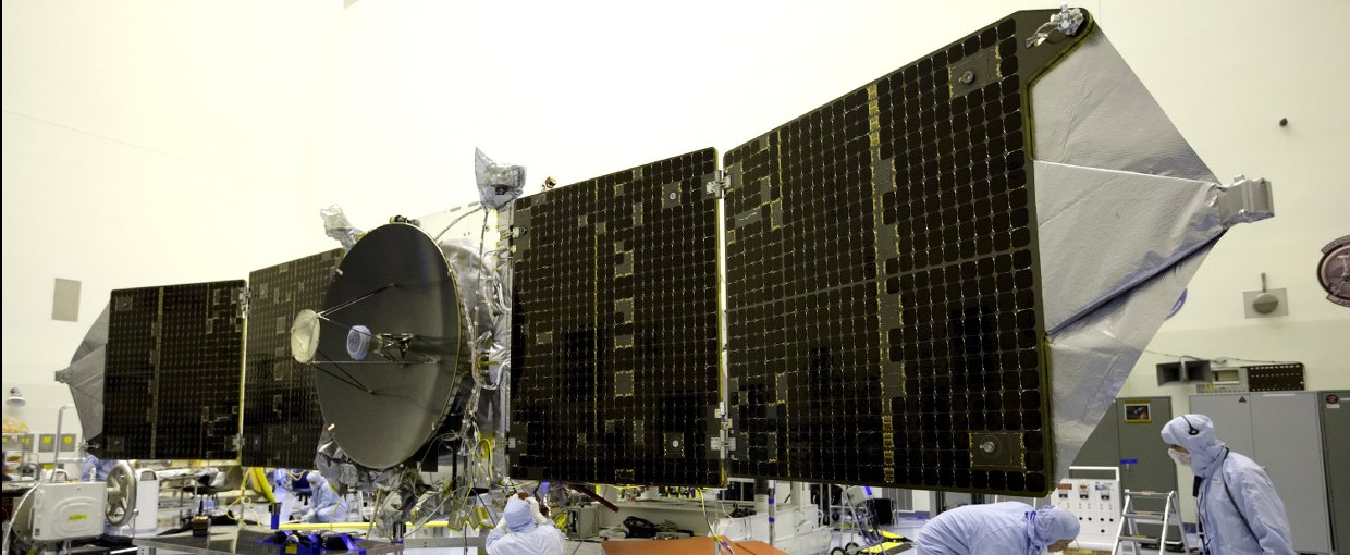 Inside the Payload Hazardous Servicing Facility at NASA's Kennedy Space Center, engineers and technicians test deploy the twin solar arrays on the Mars Atmosphere and Volatile Evolution, or MAVEN, spacecraft.