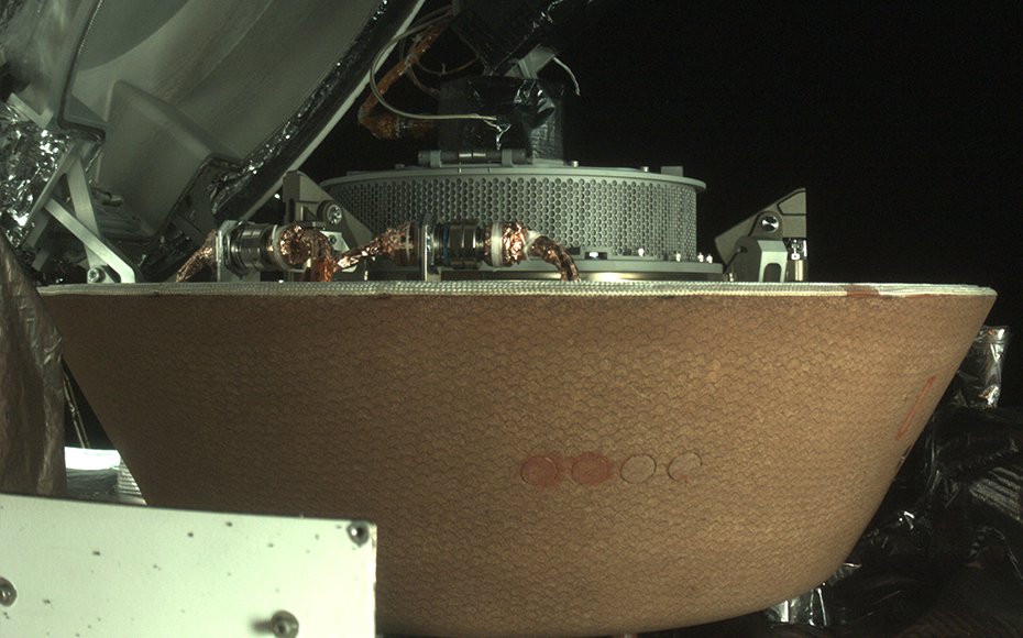 This image captured by the StowCam camera on OSIRIS-REx shows the collector head secured onto the capture ring in the Sample Return Capsule.