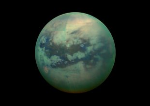 A false-color view of Titan, a moon of Saturn surrounded by a thick orange haze. Titan is believed to contain an ocean with an icy crust on top, which will be simulated in future research.