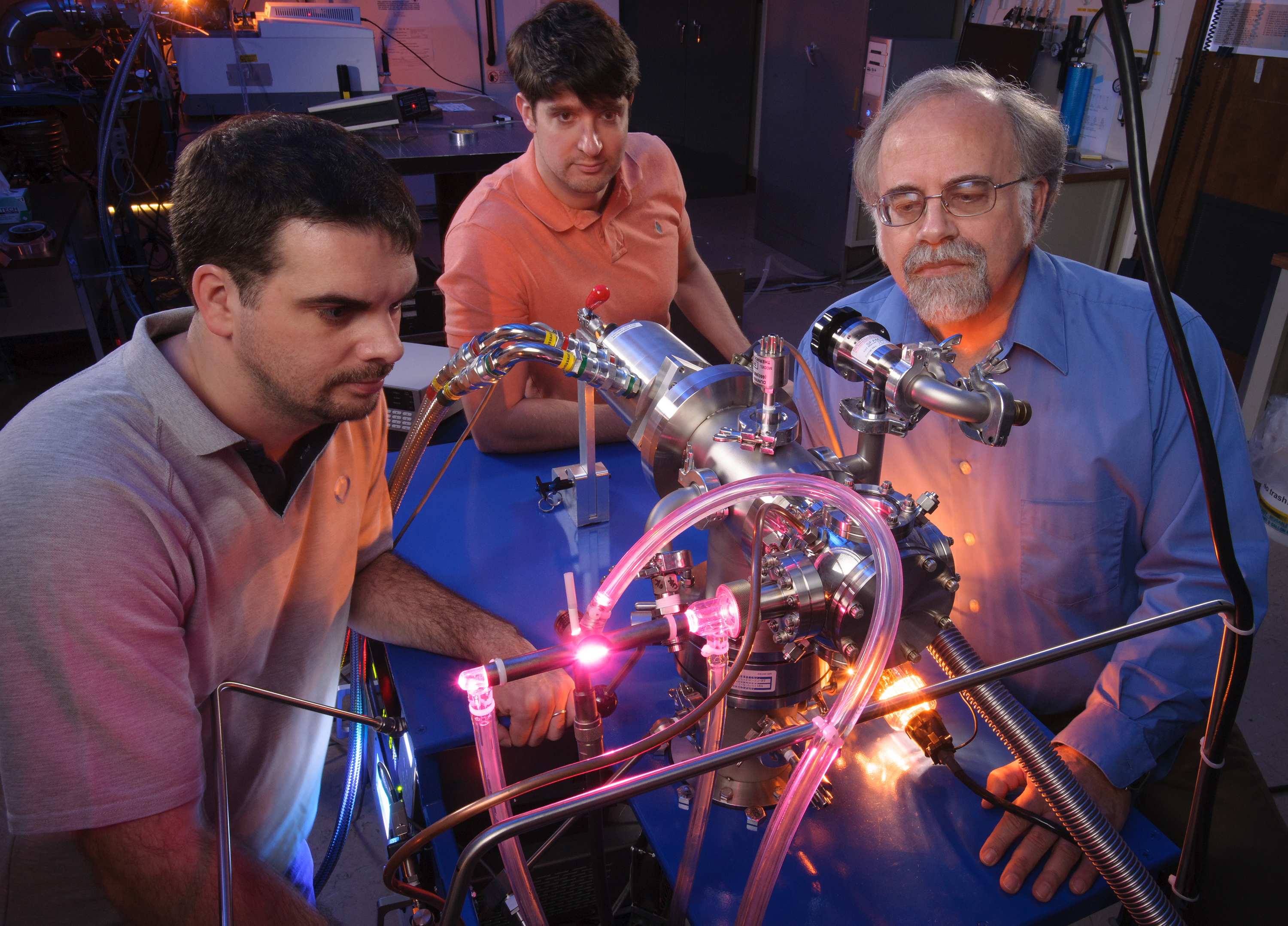 In the Astrophysics and Astrochemistry Lab at NASA's Ames Research Center, researchers Michel Nuevo, Christopher Materese, and Scott Sandford study the cosmic origins of molecules that are important to life. Credits: NASA/Ames Research Center/Dominic Hart Image credit: None