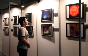 Each FETTSS exhibit is unique--curated and displayed according to each organization’s goals and resources.  A visitor enjoys the images at this FETTSS exhibit in Pasay City, Manila, The Philippines.