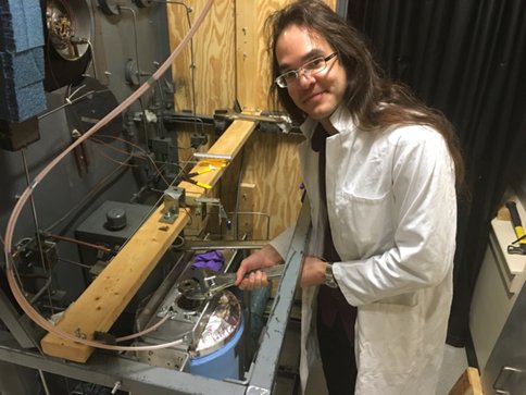 Figure 2.  Postdoc Olivier Bollengier loading high pressure apparatus at the University of Washington, Seattle.