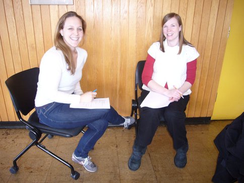 Post Doc Lindsay Hayes Smiles While Discussing Her Research With a Local Teacher