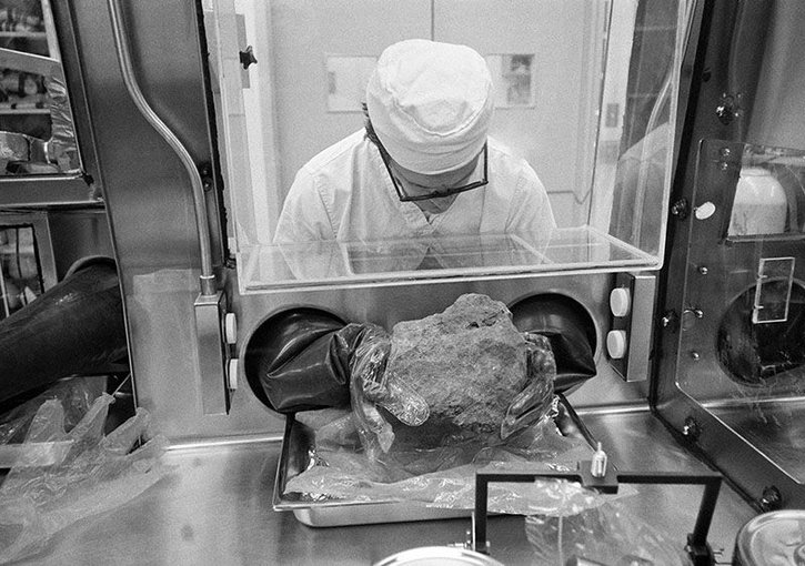 A researcher works on rocks brought back from the Moon by NASA’s 1971 Apollo 14 mission.