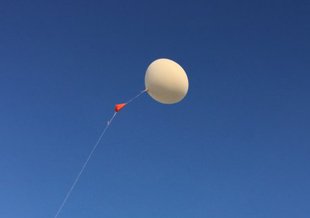 Example of a weather balloon being launched.