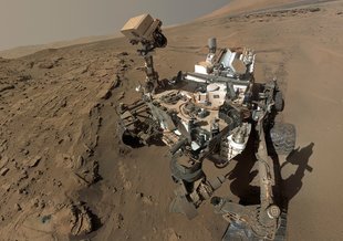 Controlling the rover from Earth, scientists drive the rover along Mars' surface inspecting geological features. Credit: NASA/JPL