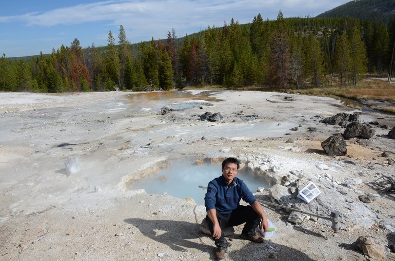 Lead author, Changyi Zhang, collecting samples in September 2014 at a hot spring in Yellowstone National Park.