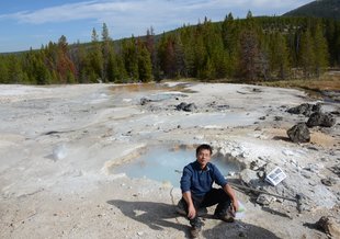 Lead author, Changyi Zhang, collecting samples in September 2014 at a hot spring in Yellowstone National Park.