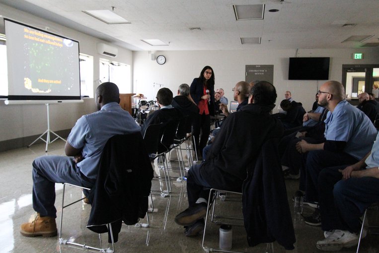 Dr. Jackie Goordial from the Bigelow Laboratory for Ocean Sciences receives a question from an inmate during her lecture at a prison in Ohio.