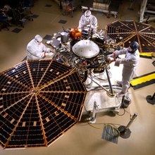 The solar arrays on NASA's InSight lander are deployed in this test inside a clean room at Lockheed Martin Space Systems, Denver. This configuration is how the spacecraft will look on the surface of Mars. The image was taken on April 30, 2015.