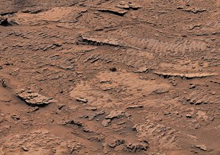 Billions of years ago, waves on the surface of a shallow lake stirred up sediment at the lake bottom. The sediment formed into rocks with rippled textures that are the clearest evidence of waves and water that NASA’s Curiosity Mars rover has ever found.