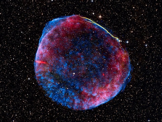 What is likely the brightest supernova in recorded human history, SN 1006 lit up planet Earth’s sky in the year 1006 AD. The expanding debris cloud from the stellar explosion, still puts on a cosmic light show across the electromagnetic spectrum. The supernova is located about 7,000 light-years from Earth, meaning that its thermonuclear explosion actually happened 7,000 years before the Earth.  Shockwaves in the remnant accelerate particles to extreme energies and are thought to be a source of the mysterious cosmic rays. NASA, ESA, Zolt Levay (STScI)