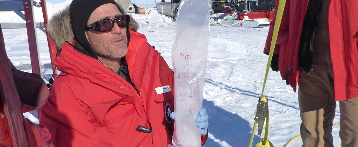 John Priscu (left) with an ice core extracted from a borehole into Lake Whillans.