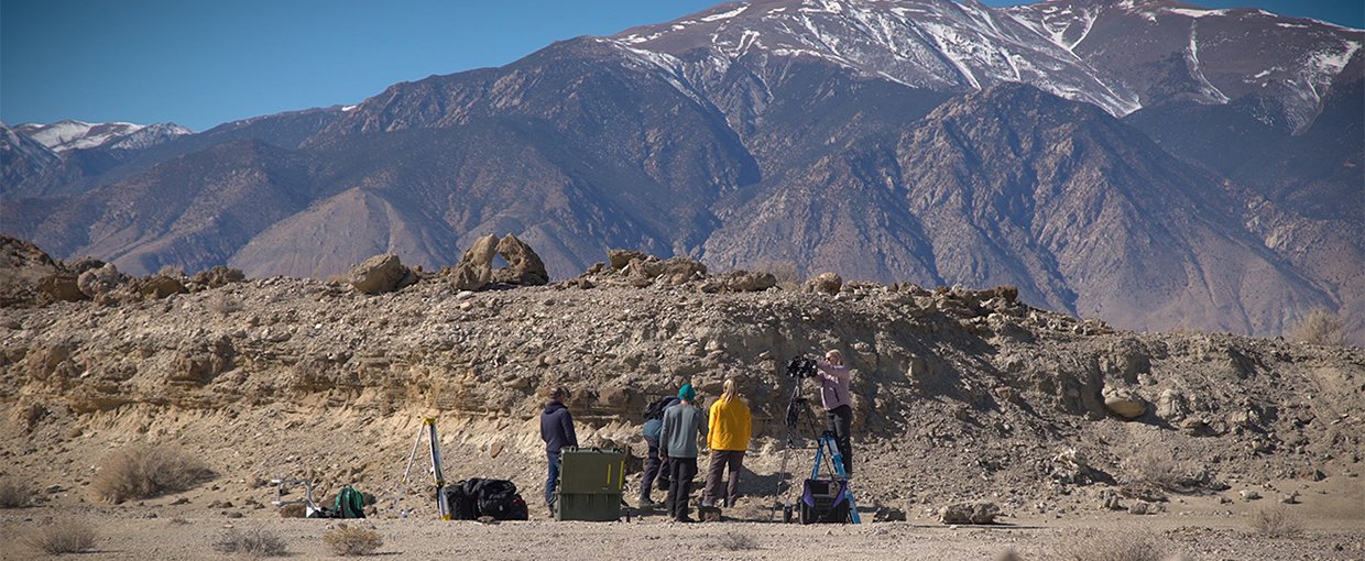 Standing in for a rover, a field team sets up equipment in a dry lakebed in the Nevada desert in February 2020. As part of the exercise, scientists spread around the world sent commands for images and data, as they will once Perseverance lands on Mars.