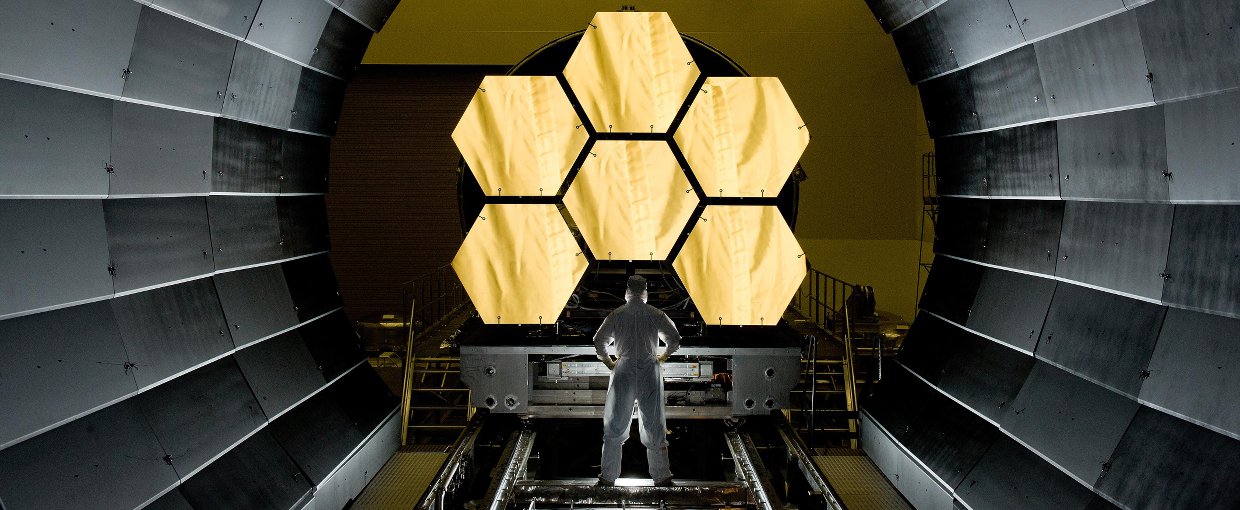 NASA engineer Ernie Wright looks on as the first six flight ready James Webb Space Telescope primary mirror segments are prepped to begin final cryogenic testing at NASA's Marshall Space Flight Center. Credit: NASA/MSFC/David Higginbotham 