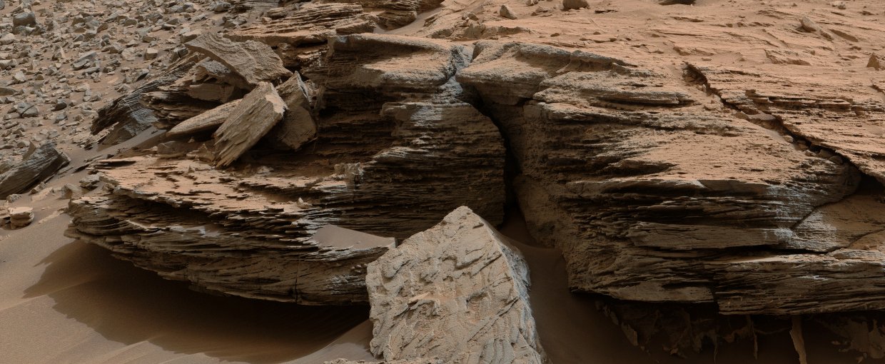 Cross-bedding that results from water passing over a loose bed of sediment. The image was taken at a target called "Whale Rock" within the "Pahrump Hills" outcrop at the base of Mount Sharp.