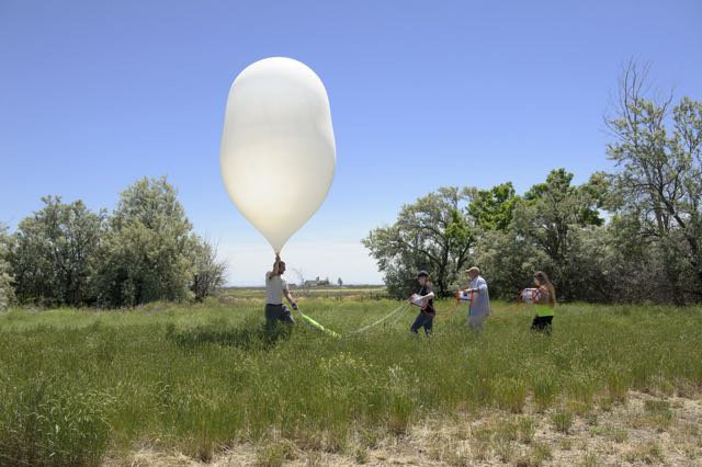 MSU Eclipse Ballooning Project team members prepare to launch a high-altitude balloon during a June test flight in Idaho. During the August 21, 2017 solar eclipse, teams across the nation will live-stream video footage of the eclipse.