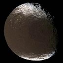 Saturn's two-faced moon tilts and rotates for Cassini in this mesmerizing movie sequence of images acquired during the spacecraft's close encounter with Iapetus on Nov. 12, 2005. 