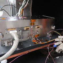 Built by NASA JPL, this transmitter - seen here exiting a thermal vacuum chamber for testing - is part of the ice-penetrating radar instrument that will fly aboard JUICE, the ESA (European Space Agency) mission to explore the Jupiter system.