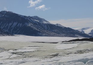 The sulfidic outcrop on the toe of the Borup Fiord Pass glacier.  This image looks south with the sulfur icings spreading eastward.