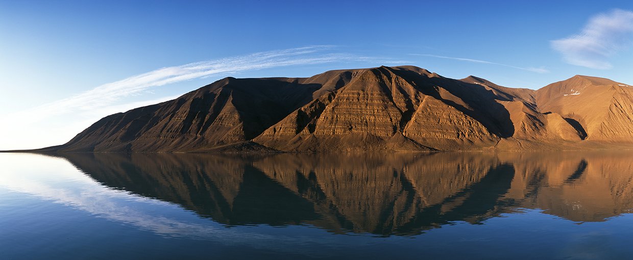 With a unique combination of volcanoes, hot springs, and permafrost, the Bockfjord Volcanic Complex on Svalbard is the only place on Earth with carbonate deposits identical to those found in the famous Martian meteorite ALH84001