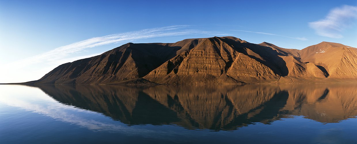 With a unique combination of volcanoes, hot springs, and permafrost, the Bockfjord Volcanic Complex on Svalbard is the only place on Earth with carbonate deposits identical to those found in the famous Martian meteorite ALH84001