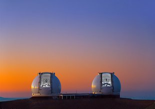 The sun sets on Mauna Kea as the twin Kecks prepare for observing.