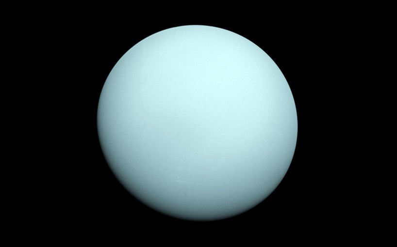 Arriving at Uranus in 1986, Voyager 2 observed a bluish orb with extremely subtle features. A haze layer hid most of the planet's cloud features from view.