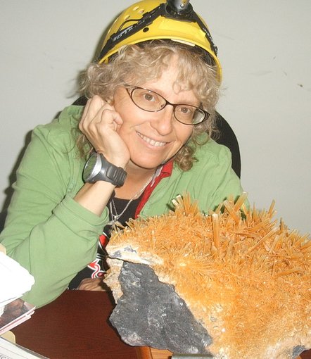 Penelope 'Penny' Boston poses with Naica Cave gypsum crystals.