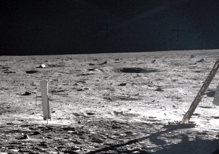 Apollo 11 Commander Neil Armstrong working at an equipment storage area on the lunar module. This is one of the few photos that show Armstrong during the moonwalk. Click image to enlarge. Credit: NASA