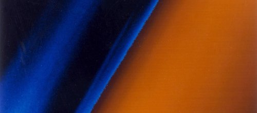 The image shows a color gradient from black at the left to blue haze moving right and rusty orange to the far right of the frame.
