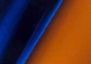 The image shows a color gradient from black at the left to blue haze moving right and rusty orange to the far right of the frame.