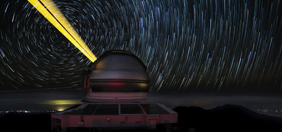 This image features the Gemini North telescope during laser guide star operations (LGS).