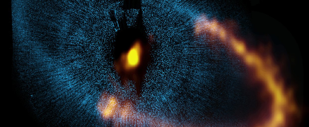 Image of the dust ring around the bright star Fomalhaut from the ALMA, and underlying blue image obtained by the NASA/ESA Hubble Space Telescope. The ALMA image provided astronomers a major breakthrough in understanding a nearby planetary system.