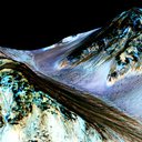 MRO captured dark streaks slopes in Hale Crater that are inferred to be formed by seasonal flow of water on present-day Mars. The imaging and topographical information in this processed, false-color view come from the HiRISE camera.