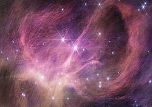 The wispy curtains filling the image are interstellar material reflecting the light from the cluster’s stars – what is known as a reflection nebula. Winds from the most massive stars in the cluster may help sculpt the large loop seen on the right side.