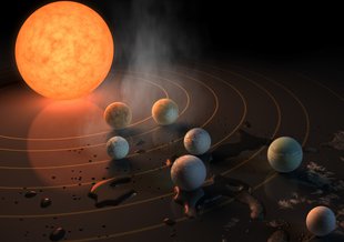 This artist's concept appeared on the Feb. 23, 2017 cover of the journal Nature announcing that the nearby star TRAPPIST-1, an ultra-cool dwarf, has seven Earth-sized planets orbiting it.