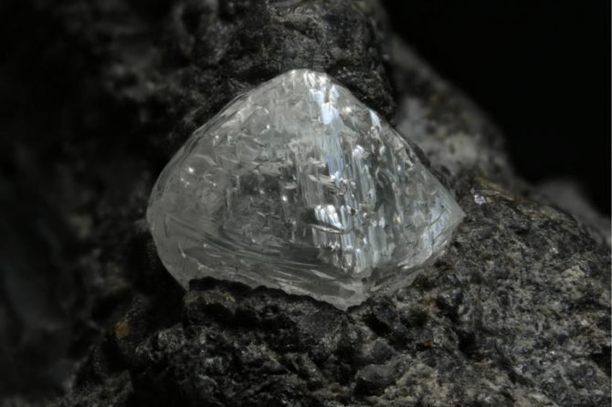 A South African diamond crystal on kimberlite, an igneous rock formed deep in the mantle and famous for the frequency with which it contains diamonds.