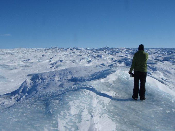 A researcher looks over the Greenland ice cap, a “frozen ocean.” Eleven scientists returned from a field campaign testing an instrument that can scrutinize holes in ice for signs of life. Someday, such an instrument might find its way to Europa or Mars. Credit: NASA/JPL-Caltech/Michael J. Malaska