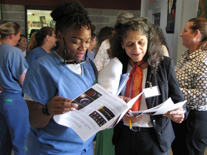 Dr. Nalini Nadkarni, founder of INSPIRE (Initiative to Bring Science Programming to the Incarcerated) at the University of Utah, visits with an inmate after a lecture in Florida.