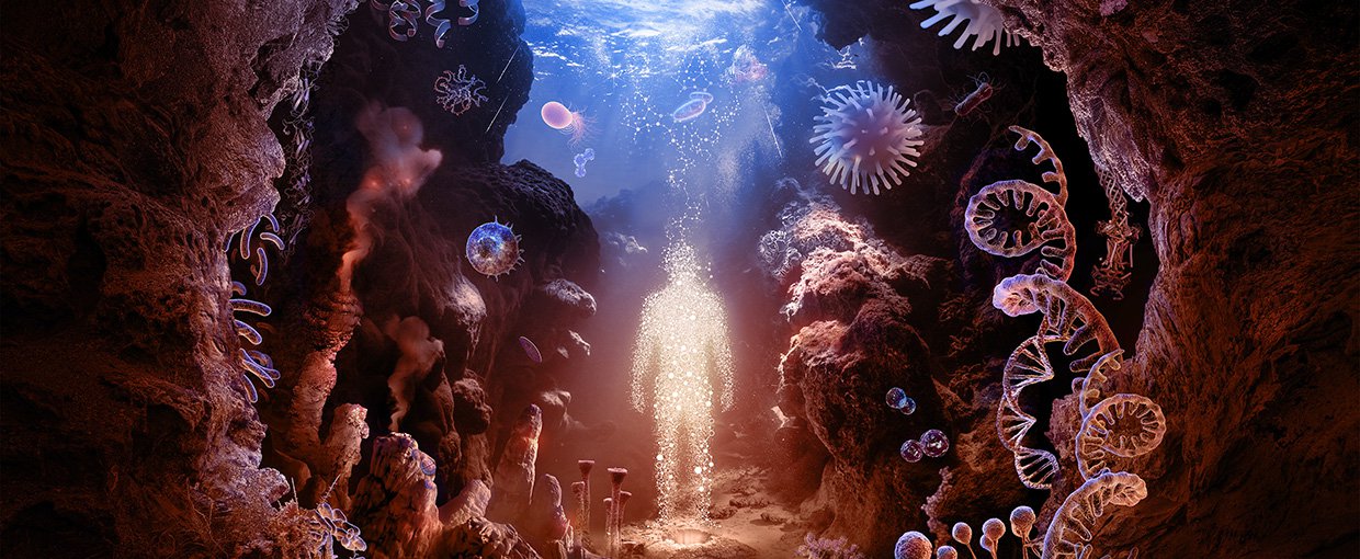 The image shows a human figure composed of starlight standing in the center of a circular collage of various forms of life relevant to astrobiology research. The life glows a soft red/pink and forms an underwater sea cave, surface of the water at top.