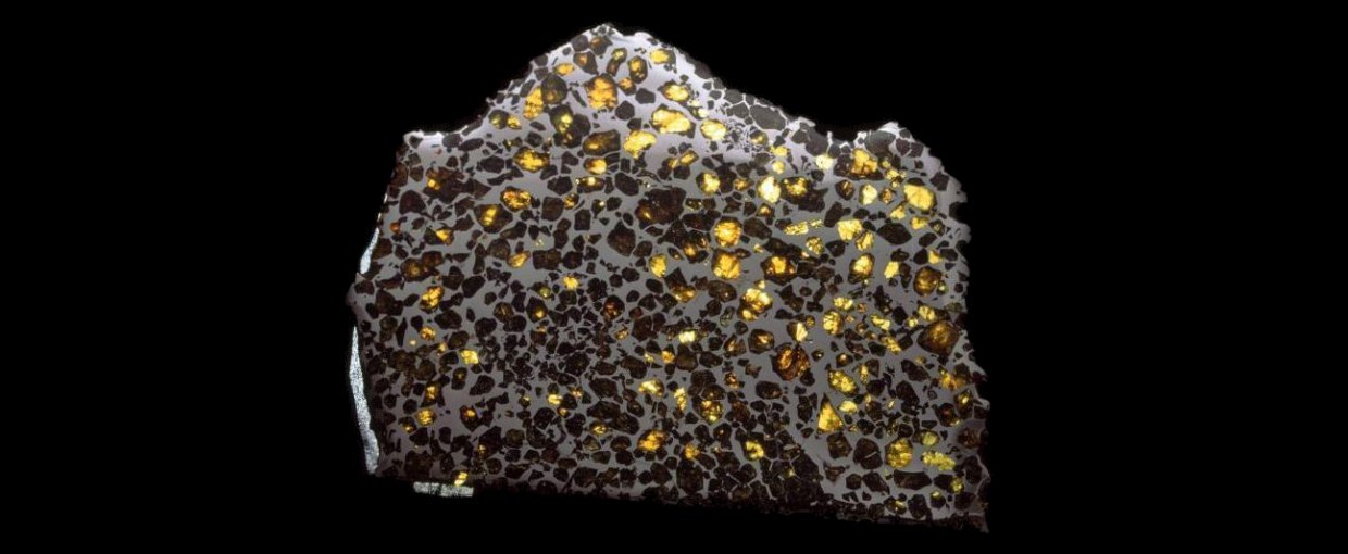 A polished, enlarged section of the Esquel pallasite meteoritemeteorite that delivered tiny nano-diamonds to Earth. This is a common occurrence, as there is believed to be substantial amounts of high-pressure carbon in the galaxies, and thus some diamonds