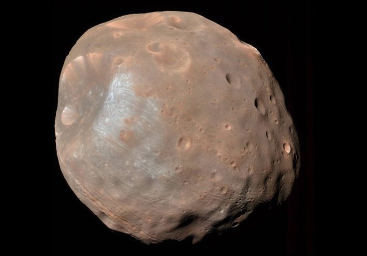 NASA’s Mars Reconnaissance Orbiter approached to within 6,800 kilometers of Phobos to capture this enhanced-color view of the moon. Phobos is a small, irregularly shaped object with a mean radius of 7.1 miles (11) km.