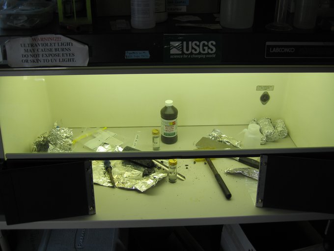 Core samples for biological studies are carefully handled and sub-sampled under sterile conditions in an on site microbiology laboratory at the CBIS drill site.